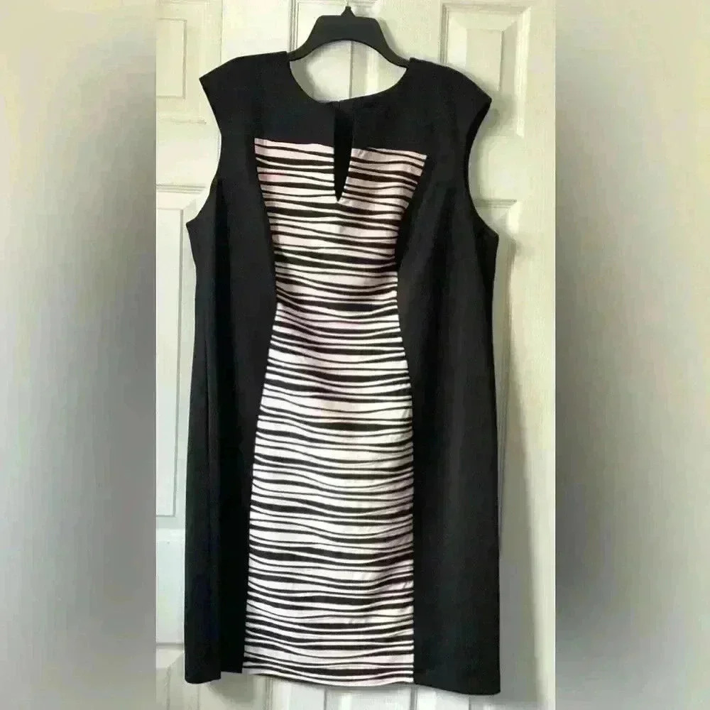 Connected Apparel  black dress, center stripes for hourglass shaping, size 20W